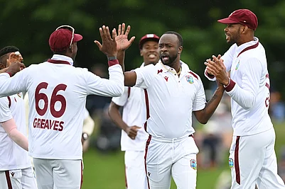 | Photo: Andrew Cornaga/Photosport via AP : West Indies bowler Kemar Roach, second right, celebrates with teammates after taking the wicket of New Zealands Devon Conway during their cricket test match in Christchurch, New Zealand.