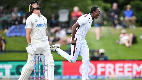 | Photo: AP/Andrew Cornaga : West Indies bowler Johann Layne celebrates the wicket of New Zealands Will Youn during their cricket test match in Christchurch on December 2, 2025.