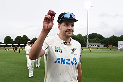 | Photo: Andrew Cornaga/Photosport via AP : New Zealands Jacob Duffy hold up the ball after taking 5 wickets against the West Indies during the second day of their cricket test match in Christchurch, New Zealand.
