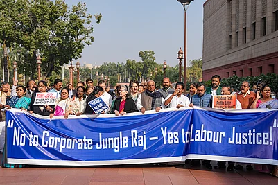 | Photo: PTI/Ravi Choudhary : Congress leader Sonia Gandhi and Congress President Mallikarjun Kharge with others during a protest at the Parliament complex during the Winter Session, in New Delhi.