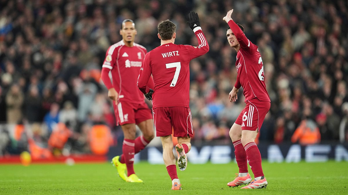 | Photo: AP/Jon Super : Liverpool's Florian Wirtz celebrates with with Milos Kerkez and Virgil van Dijk after Sunderland's Nordi Mukiele scored the own goal during the English Premier League match on December 3, 2025. 