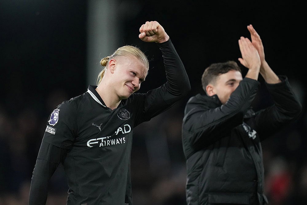 | Photo: AP/Kirsty Wigglesworth : Manchester City's Erling Haaland, reacts after his teams win during the English Premier League soccer match between Fulham and Manchester City in London.