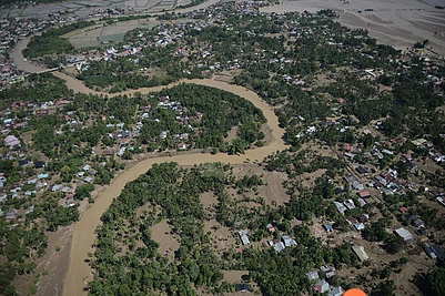 | Photo: AP/Reza Saifullah : This aerial photo taken from a national disaster mitigation agencys helicopter during an aerial aid distribution shows an area affected by floods in Pidie Jaya, Aceh province, Indonesia.