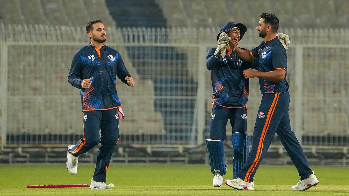 Photo: PTI : Jammu and Kashmirs Auqib Nabi, right, celebrates with teammates after taking the wicket of Bihars Vaibhav Suryavanshi during a Syed Mushtaq Ali Trophy 2025 match in in Kolkata.