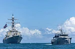 Zuma Press Wire : The U.S Navy Arleigh Burke-class guided-missile destroyer USS Winston S. Churchill, left, patrols with the Guyana Defence Force Defiant-class patrol vessel GDFS Shahous, right, during counter narcotics operations, November 22, 2025 in the Caribbean Sea