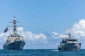 Zuma Press Wire : The U.S Navy Arleigh Burke-class guided-missile destroyer USS Winston S. Churchill, left, patrols with the Guyana Defence Force Defiant-class patrol vessel GDFS Shahous, right, during counter narcotics operations, November 22, 2025 in the Caribbean Sea
