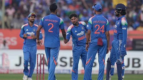 Photo: AP : India Vs South Africa Live Cricket Score, 3rd ODI: Kuldeep Yadav celebrates with teammates the wicket of Marco Jansen in Visakhapatnam.