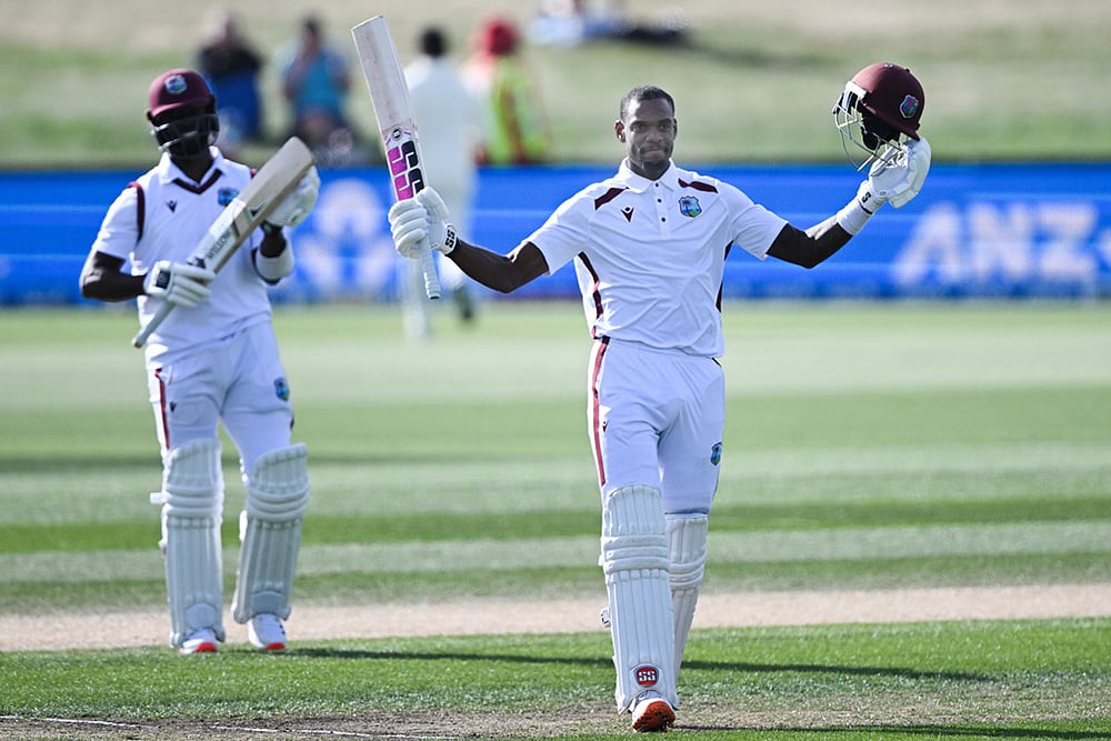 | Photo: Andrew Cornaga/Photosport via AP : West Indies Justin Greaves, right, raises his bat after scoring 200 runs against New Zealand on Day 5 of their cricket test match in Christchurch, New Zealand.