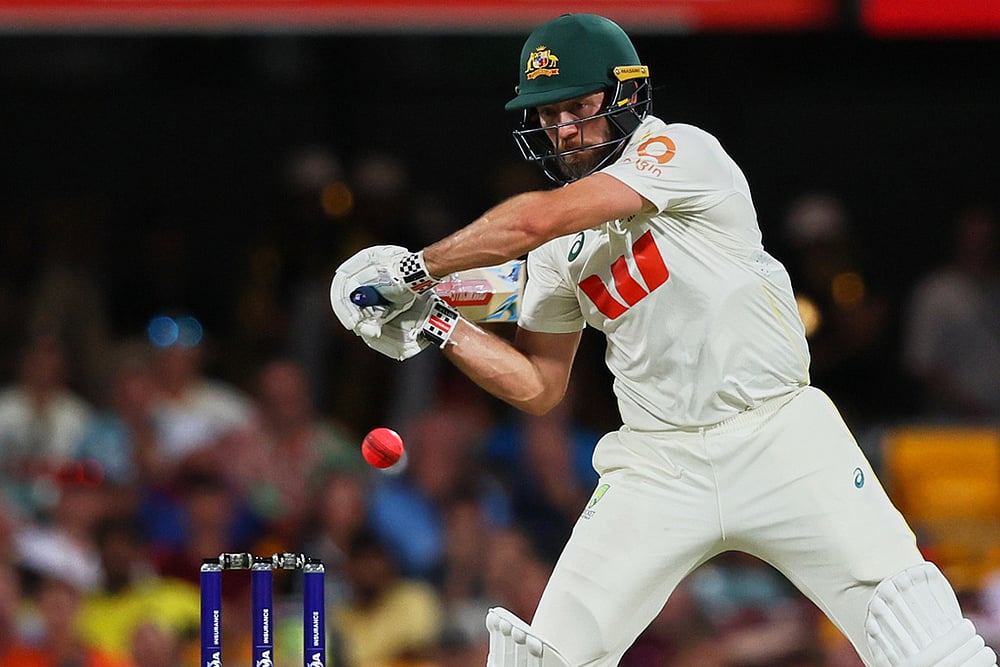 | Photo: AP/Tertius Pickard : Australias Michael Neser plays a shot during the second Ashes cricket test match between Australia and England in Brisbane.