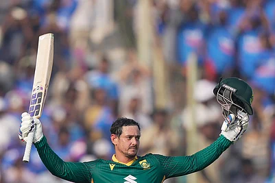 | Photo: AP/Mahesh Kumar A. : South Africas Quinton de Kock celebrates his century during the third One Day International cricket match between India and South Africa in Visakhapatnam.