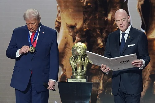 AP Photo/ Evan Vucci : President Donald Trump is presented with the inaugural FIFA Peace Prize by FIFA President Gianni Infantino during the 2026 FIFA World Cup draw at the Kennedy Center, Friday, Dec. 5, 2025, in Washington.