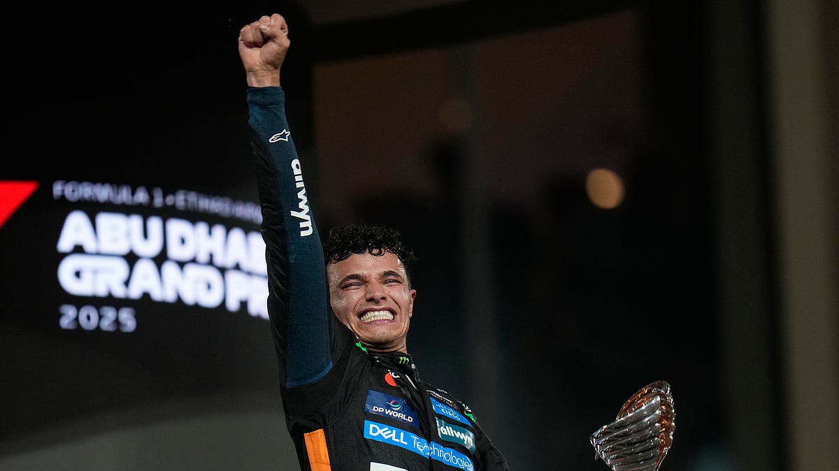 (AP Photo/Darko Bandic) : McLaren driver Lando Norris of Britain reacts after becoming a world champion after the Abu Dhabi Formula One Grand Prix in Abu Dhabi, United Arab Emirates, Sunday, Dec. 7, 2025.