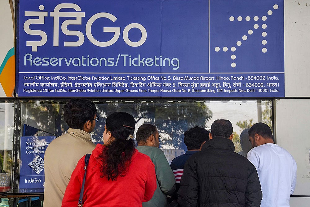 | Photo: PTI : Passengers enquire at an IndiGo airlines counter amid flight disruptions, at Birsa Munda Airport, in Ranchi.