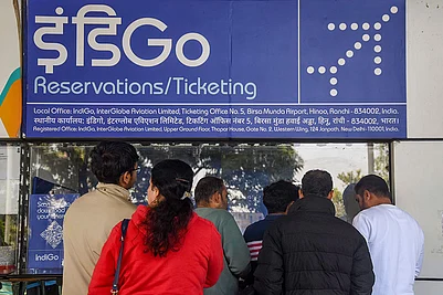 | Photo: PTI : Passengers enquire at an IndiGo airlines counter amid flight disruptions, at Birsa Munda Airport, in Ranchi.