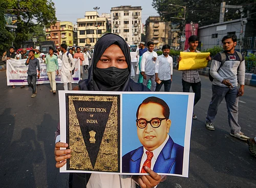 Manvender Vashist Lav : A student of Aliha University shows a placard during a protest rally demanding simplification of the process of including Waqf properties in the Waqf Portal and increasing of the time limit, in Kolkata, Thursday, Dec. 4, 2025.