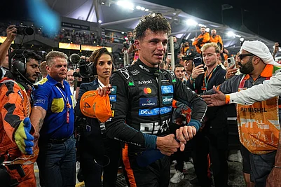 | Photo: AP/Fatima Shbair : New Formula One World Champion McLaren driver Lando Norris of Britain leaves the track after the Formula One Abu Dhabi Grand Prix at the Yas Marina Circuit in Abu Dhabi, UAE.
