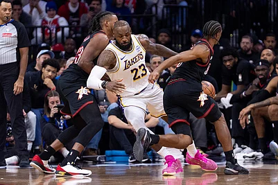 | Photo: AP/Chris Szagola : Los Angeles Lakers LeBron James, center, gets the ball stolen by Philadelphia 76ers Tyrese Maxey, right, as Jabari Walker, left, is defending during the second half of an NBA basketball game in Philadelphia.