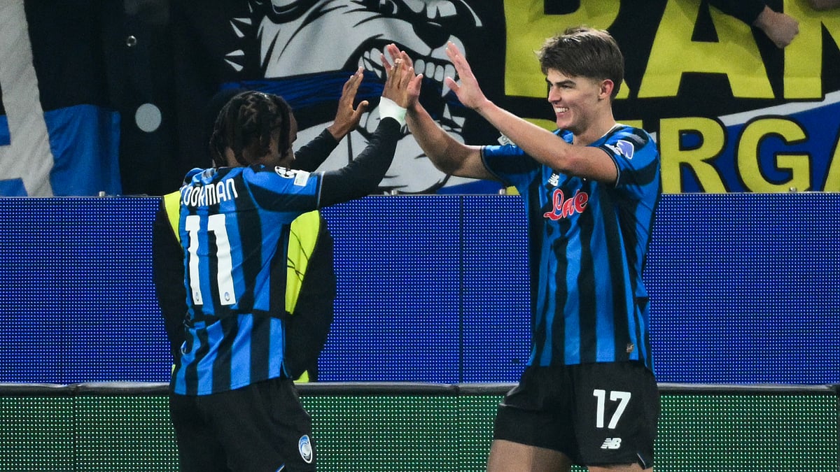 Atalanta's Charles De Ketelaere celebrates his winner with Ademola Lookman during the UEFA Champions League match against Chelsea.