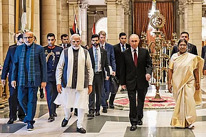 Photo: PTI : Walk of Warmth: Prime Minister Narendra Modi with President Vladimir Putin at the Rashtrapati Bhavan in New Delhi