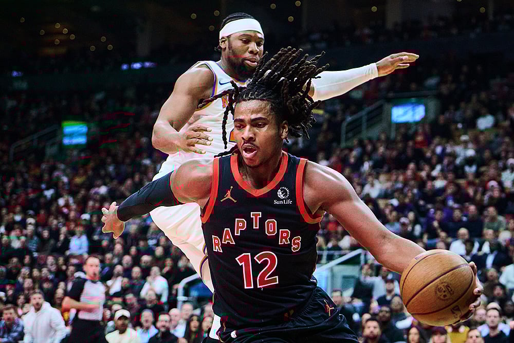 | Photo: Sammy Kogan/The Canadian Press via AP : Toronto Raptors Collin Murray-Boyles (12) drives past New York Knicks Guerschon Yabusele (28) during the first half of an NBA Cup basketball game in Toronto.