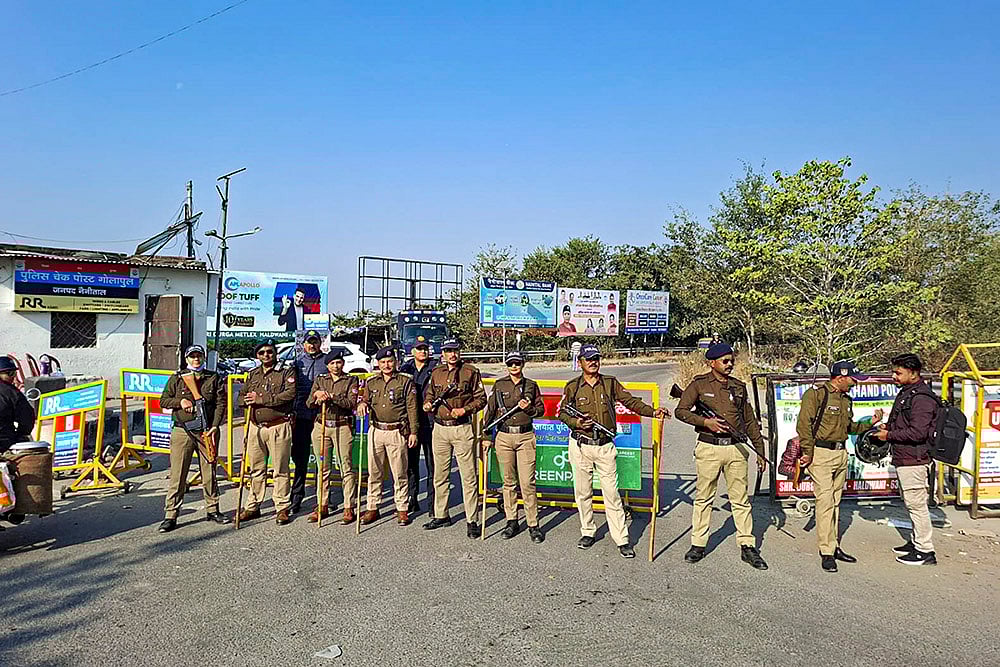 | Photo: PTI : Police personnel patrol the Banbhoolpura area ahead of the Supreme Court order in the railway land encroachment case, in Haldwani, Uttarakhand.