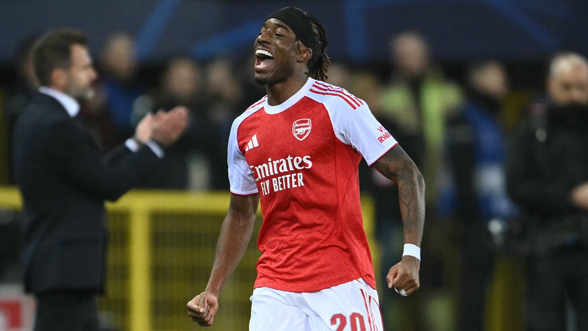 Arsenal's Noni Madueke celebrates scoring for his side during the UEFA Champions League match against Club Brugge.
