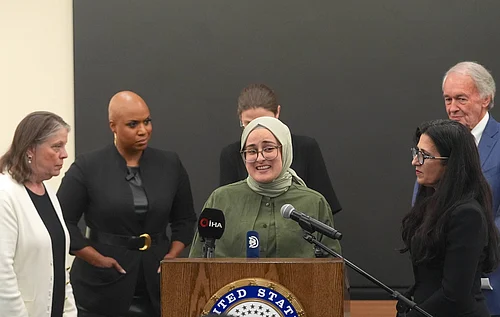 IMAGO / Anadolu Agency : Rumeysa Ozturk speaks at a press conference at Boston Logan International Airport on Saturday, May 10, following her recent release from federal custody. New York United States.