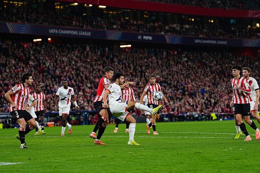 | Photo: AP/Miguel Oses : PSGs Goncalo Ramos kicks the ball as Athletic Bilbaos Mikel Vesga tries to stop him during the Champions League opening phase soccer match between Athletic Bilbao and PSG in Bilbao, Spain.