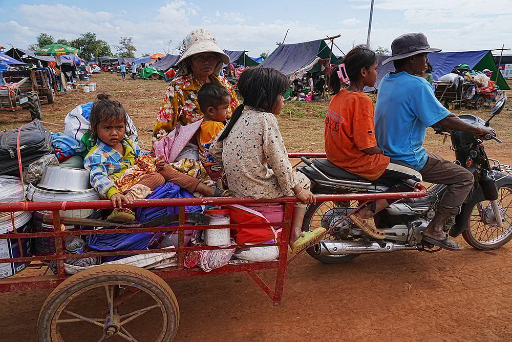 | Photo: AP/Heng Sinith : A family arrives to take refuge at Chonkal in Oddar Meanchey province, Cambodia after fleeing from home following fighting between Thailand and Cambodia over territorial claims. 