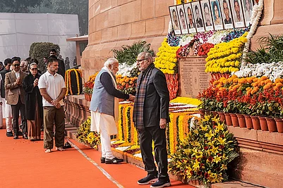 | Photo: PTI/Shahbaz Khan : Prime Minister Narendra Modi pays tribute to the martyrs of the 2001 Parliament attack during a ceremony to mark its 24th anniversary, at Samvidhan Sadan, in New Delhi. Vice President CP Radhakrishnan and LoP in the Lok Sabha Rahul Gandhi are also seen.