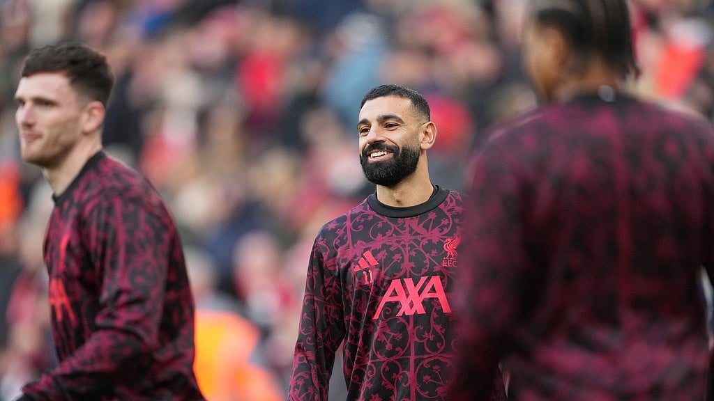 AP : Mohamed Salah, centre, warms up prior to the English Premier League match between Liverpool and Brighton and Hove Albion.