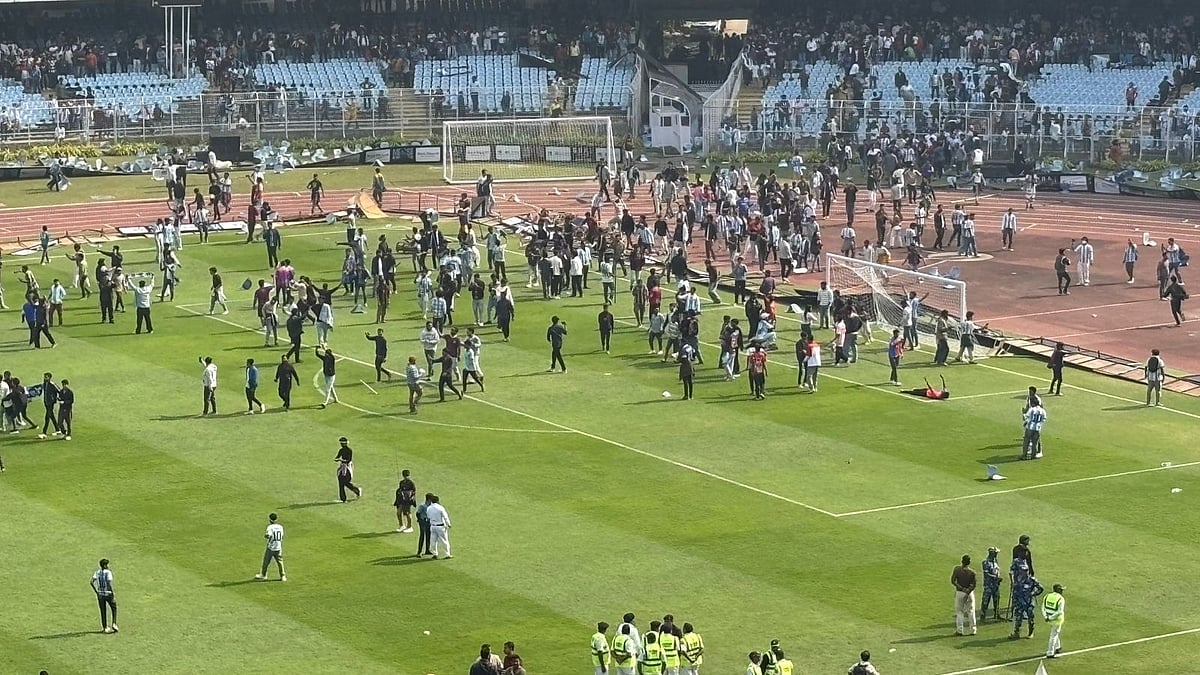Sushruta Bhattacharjee/Outlook : Irate fans invading the pitch at the Salt Lake Stadium in Kolkata during Lionel Messi's GOAT India Tour 2025.