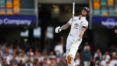 | Photo: AP/Tertius Pickard : Englands captain Ben Stokes throws bat after loosing his wicket during the second Ashes cricket test match between Australia and England in Brisbane.