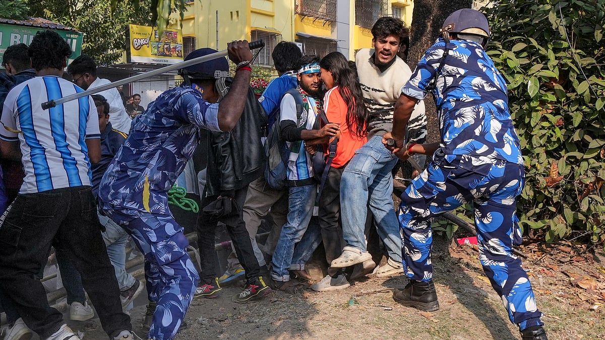 PTI : Security personnel lathi-charge fans after they gathered near the Salt Lake Stadium following chaos at an event of Argentine footballer Lionel Messi as part of his 'G.O.A.T. India Tour 2025', in Kolkata.