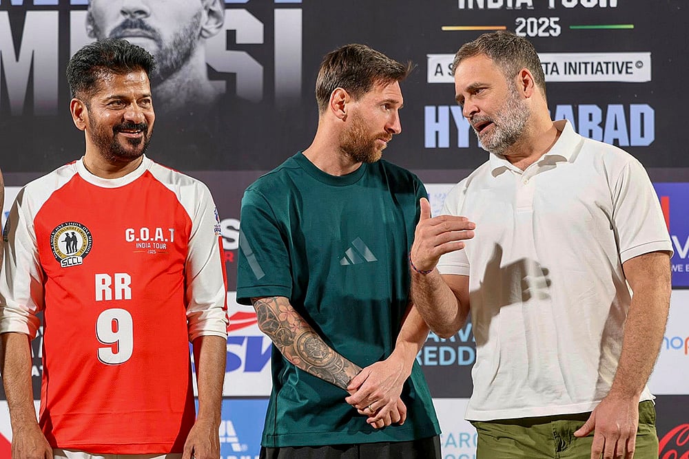 | Photo: AICC via PTI : Leader of Opposition in the Lok Sabha Rahul Gandhi, Telangana Chief Minister Revanth Reddy with Argentine footballer and 2022 FIFA World Cup winning captain Lionel Messi during an event as part of the GOAT India Tour 2025, in Hyderabad. 