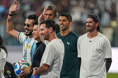 | Photo: PTI/Kunal Patil : Cricket legend Sachin Tendulkar with Argentine footballer and 2022 FIFA World Cup winning captain Lionel Messi and his Inter Miami teammates Rodrigo De Paul and Luis Suarez during an event as part of the GOAT India Tour 2025, at the Wankhede Stadium, in Mumbai.