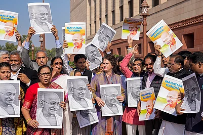 | Photo: PTI/Salman Ali : Congress MP Priyanka Gandhi Vadra and other opposition MPs participate in a protest march against the VB-G RAM G Bill, introduced by the union government to replace the Mahatma Gandhi National Rural Employment Guarantee Act (MGNREGA), 2005, during the Winter session of Parliament, in New Delhi.