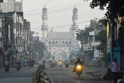 | Photo: PTI : Commuters on a foggy winter morning near the Charminar, in the Old City of Hyderabad, Telangana.