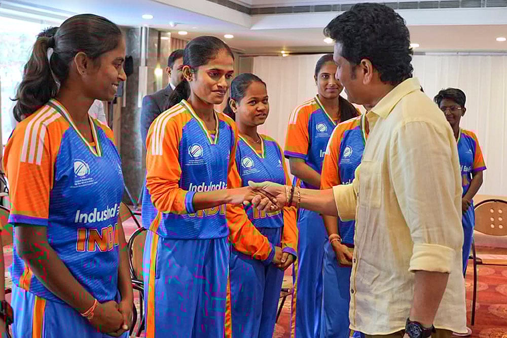 | Photo: Handout via PTI : Cricket legend Sachin Tendulkar interacts with the Indian Women’s Blind Cricket Team after they won the T20 Blind Cricket World Cup, at the MIG Cricket Club, in Mumbai. 