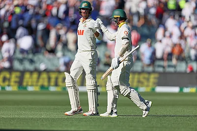 | Photo: AP/James Elsby : Australias Mitchell Starc, left, and his batting partner Nathan Lyon walk back to the pavilion at the end of day one of the third Ashes cricket Test between England and Australia at the Adelaide Oval in Adelaide, Australia.