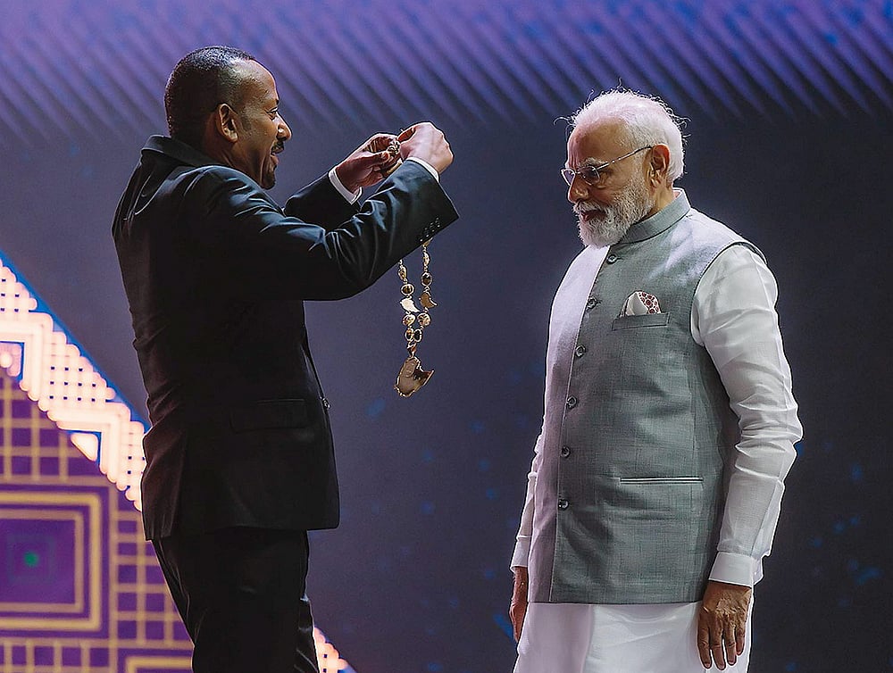 | Photo: @PMEthiopia/X via PTI  : Prime Minister Narendra Modi being conferred with Ethiopias highest award The Great Honour Nishan of Ethiopia by his Ethiopian counterpart Abiy Ahmed Ali during a ceremony at the Addis International Convention Centre, in Addis Ababa. 