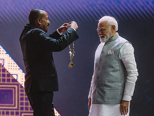 | Photo: @PMEthiopia/X via PTI : Prime Minister Narendra Modi being conferred with Ethiopias highest award The Great Honour Nishan of Ethiopia by his Ethiopian counterpart Abiy Ahmed Ali during a ceremony at the Addis International Convention Centre, in Addis Ababa.