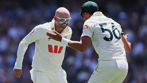 AP : Australias Nathan Lyon, left, celebrates with teammate Mitchell Starc after dismissing Englands Ben Duckett during play on day two of the third Ashes Test.