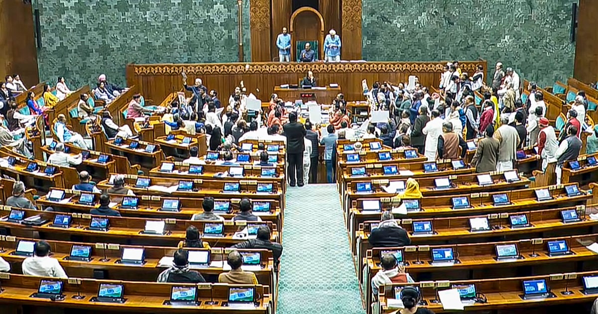 THIRD PARTY IMAGE; SCREENGRAB VIA SANSAD TV : Opposition MPs protest in the well as Union Minister Shivraj Singh Chouhan (unseen) speaks in the Lok Sabha during the Winter session of Parliament