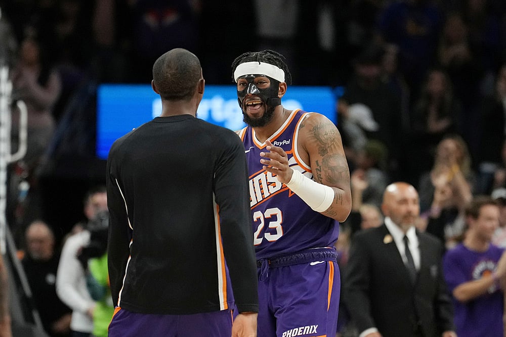 | Photo: AP/Ross D. Franklin : Phoenix Suns guard Jordan Goodwin (23) celebrates his game-winning free throw against the Golden State Warriors with Suns guard Jamaree Bouyea as time expires during the second half of an NBA basketball game in Phoenix. 