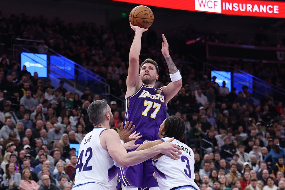 | Photo: AP/Rob Gray : Los Angeles Lakers guard Luka Doncic (77) shoots over Utah Jazz forward Kevin Love (42) and guard Keyonte George (3) during the second half of an NBA basketball game, in Salt Lake City. 