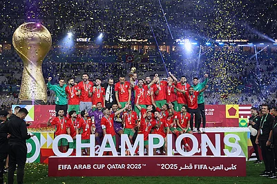 | Photo: AP/Hussein Sayed : Moroccos players celebrate with the winner trophy after defeating Jordan in the FIFA Arab Cup final soccer match in Lusail, Qatar.