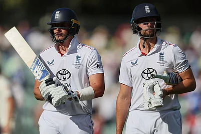 | Photo: AP/James Elsby : Englands Jamie Smith, left, and Will Jacks walk from the field after play ended on day four of the third Ashes cricket test between England and Australia in Adelaide, Australia.