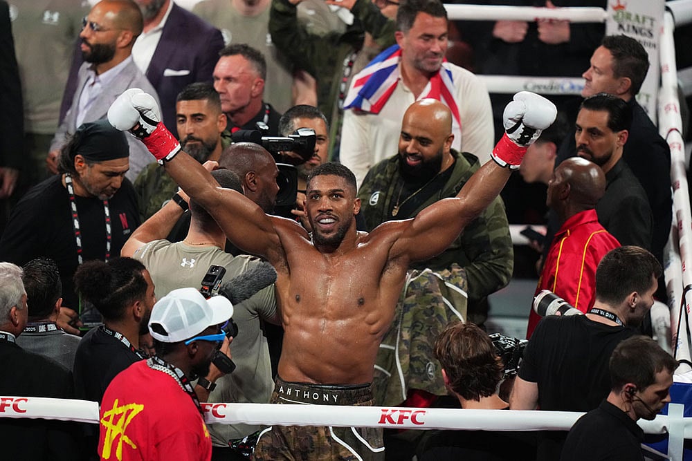 | Photo: AP/Lynne Sladky : Anthony Joshua celebrates after his win in the heavyweight boxing match against Jake Paul in Miami, Fla.