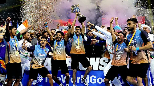 File/PTI : The Indian mens team celebrates with the trophy after winning the inaugural Kho Kho World Cup in New Delhi.